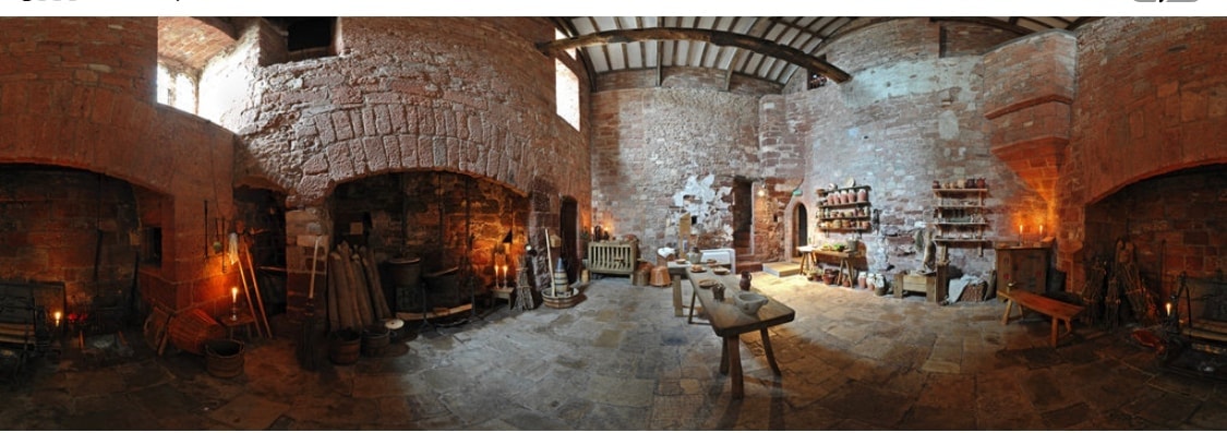 Interior of St Nicholas Priory, Exeter — ancient stone walls and natural light